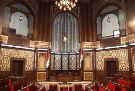 قاعة المجلس النيابي السوري وقد حفرت في مدرجها الخشبي انامل موسس العائلة الفنان فارس زيتون وولديه الفنانين نقولا وجورج بتكليف من المتعهد المرحوم السيد تحسين خياط 